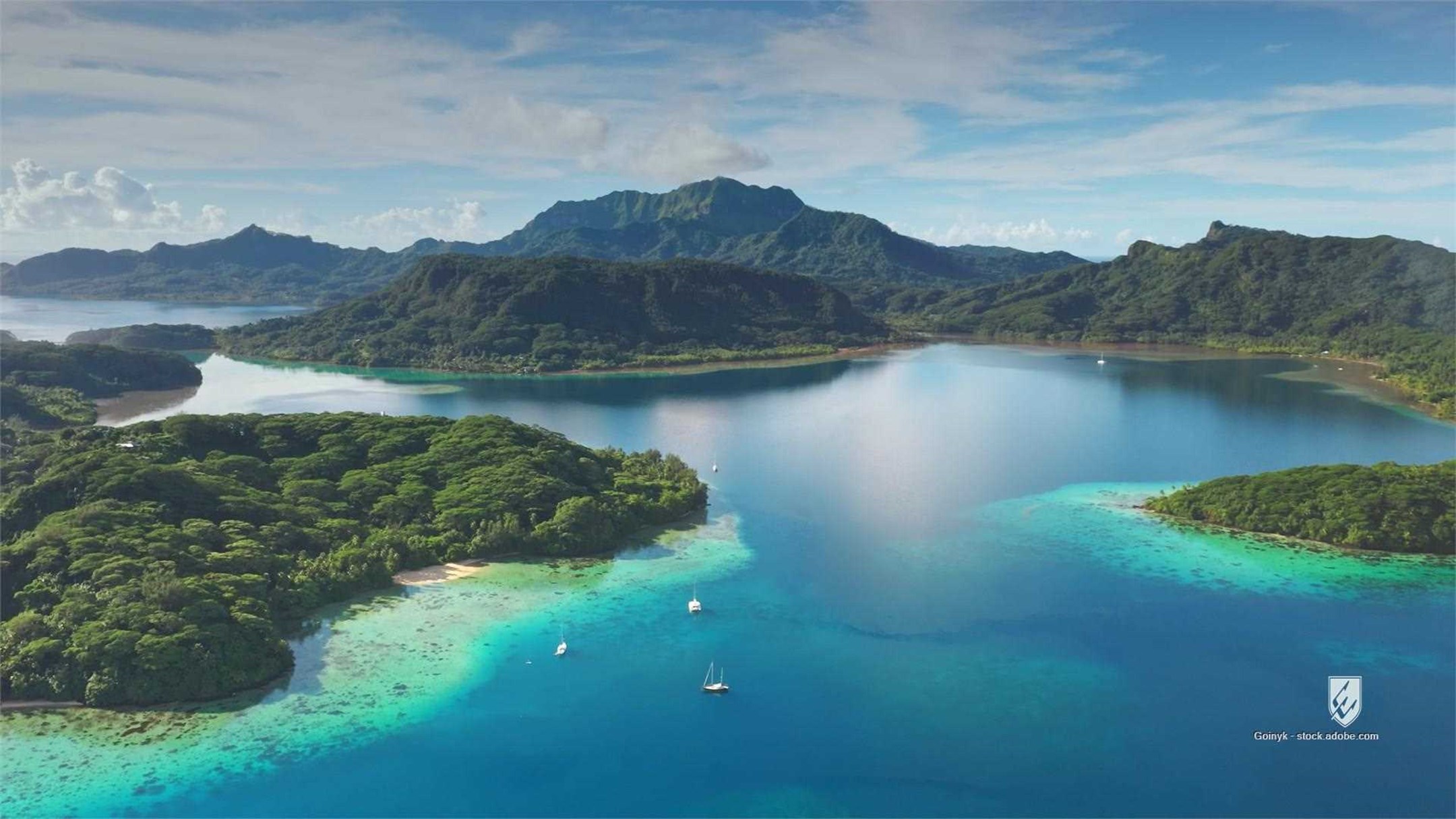 French Polynesia Bora Bora island aerial view tropical lagoon ocean sea water drone blue turquoise green lush vegetation
