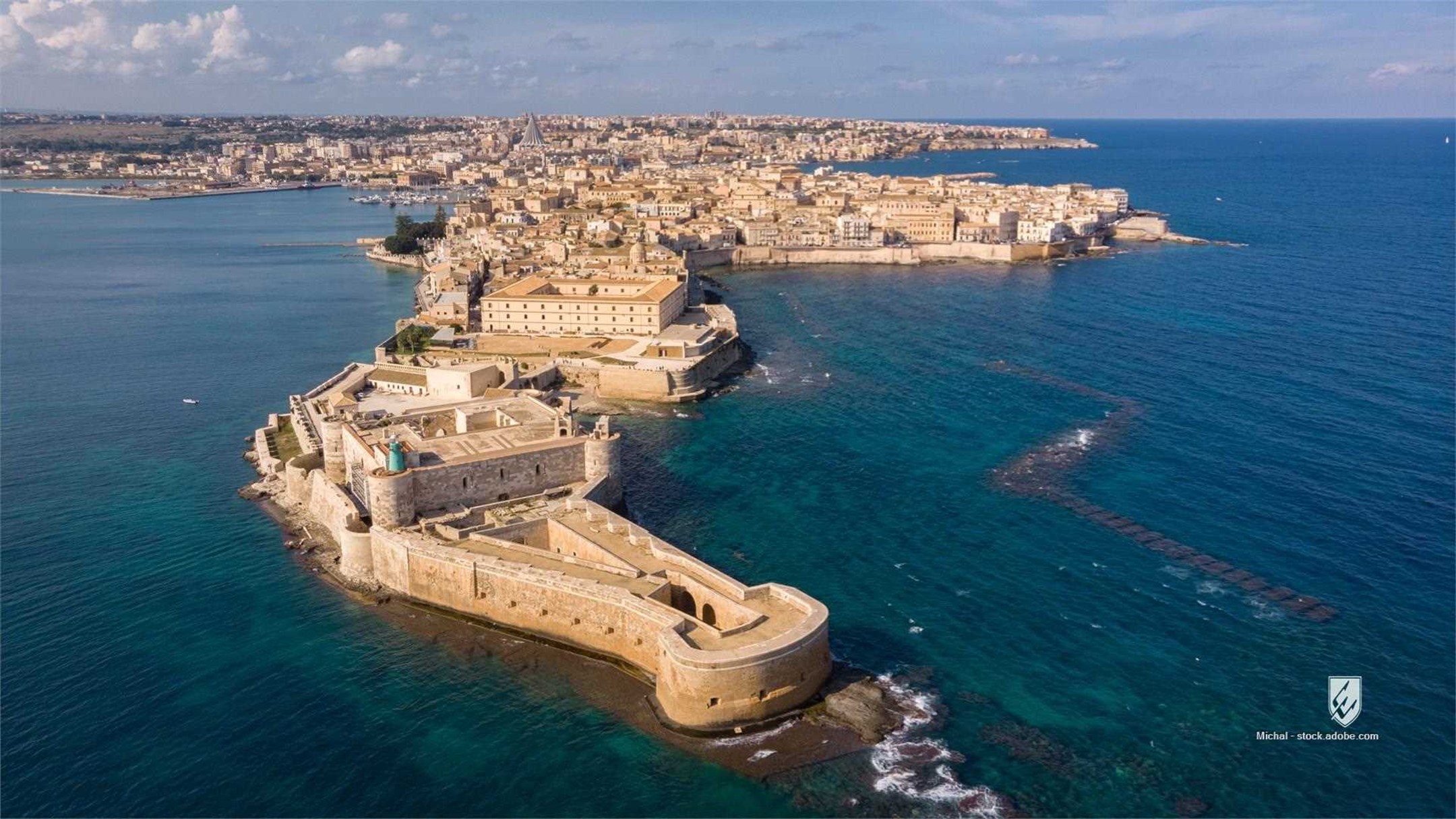 Maniace fortress Ortigia aerial aerial view architecture beach blue boat building castello castle city cliff coast