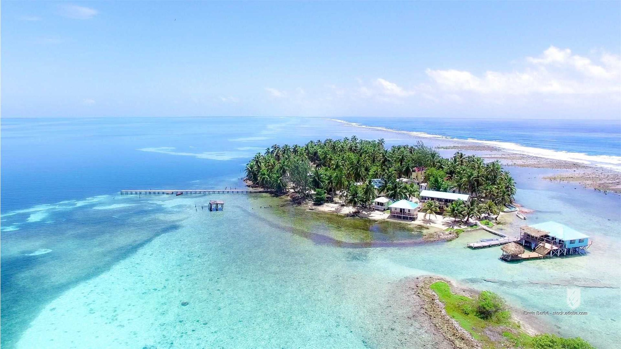 Belize aerial america anchored barrier beach blue bungalow caribbean caye central drone holiday island lodge palm paradi