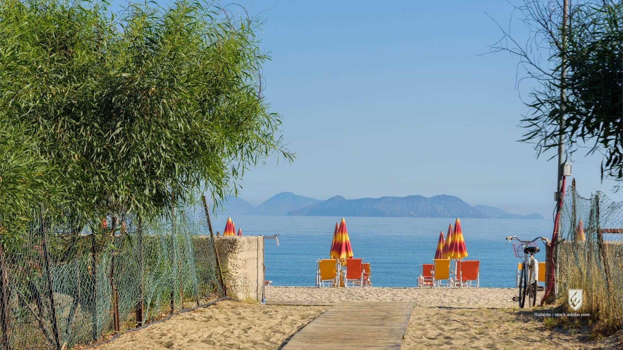 beach sea sand sky blue water summer travel architecture ocean island coast sun tourism vacation holiday house people na