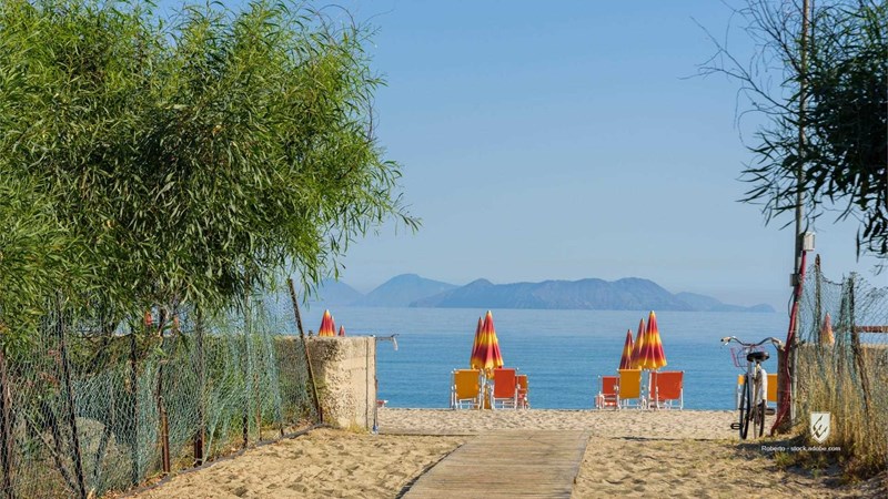 beach sea sand sky blue water summer travel architecture ocean island coast sun tourism vacation holiday house people na