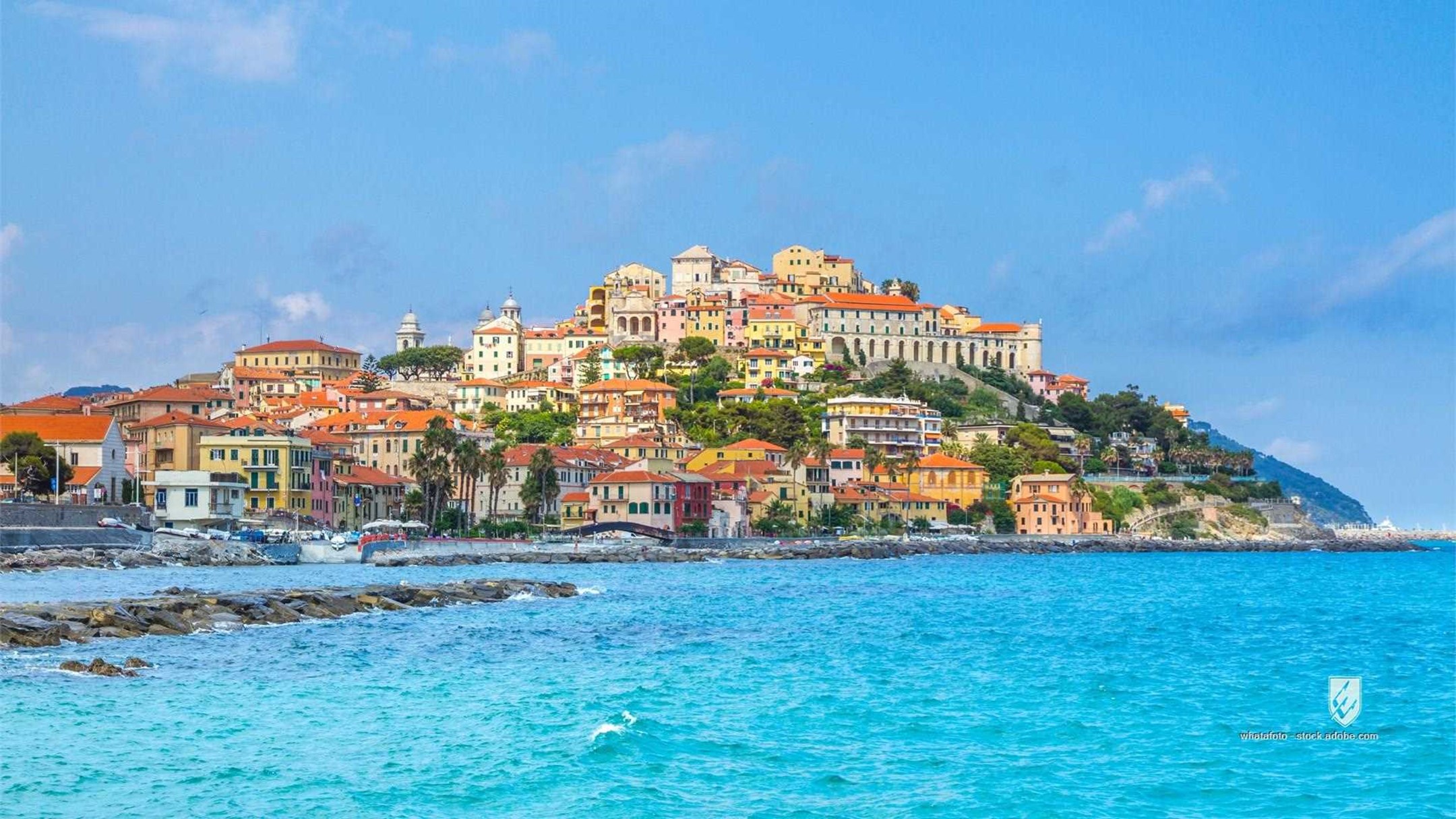daylight coastline hill-town beautiful townscape fishing harbour summer color buildings boats waves dock houses holiday
