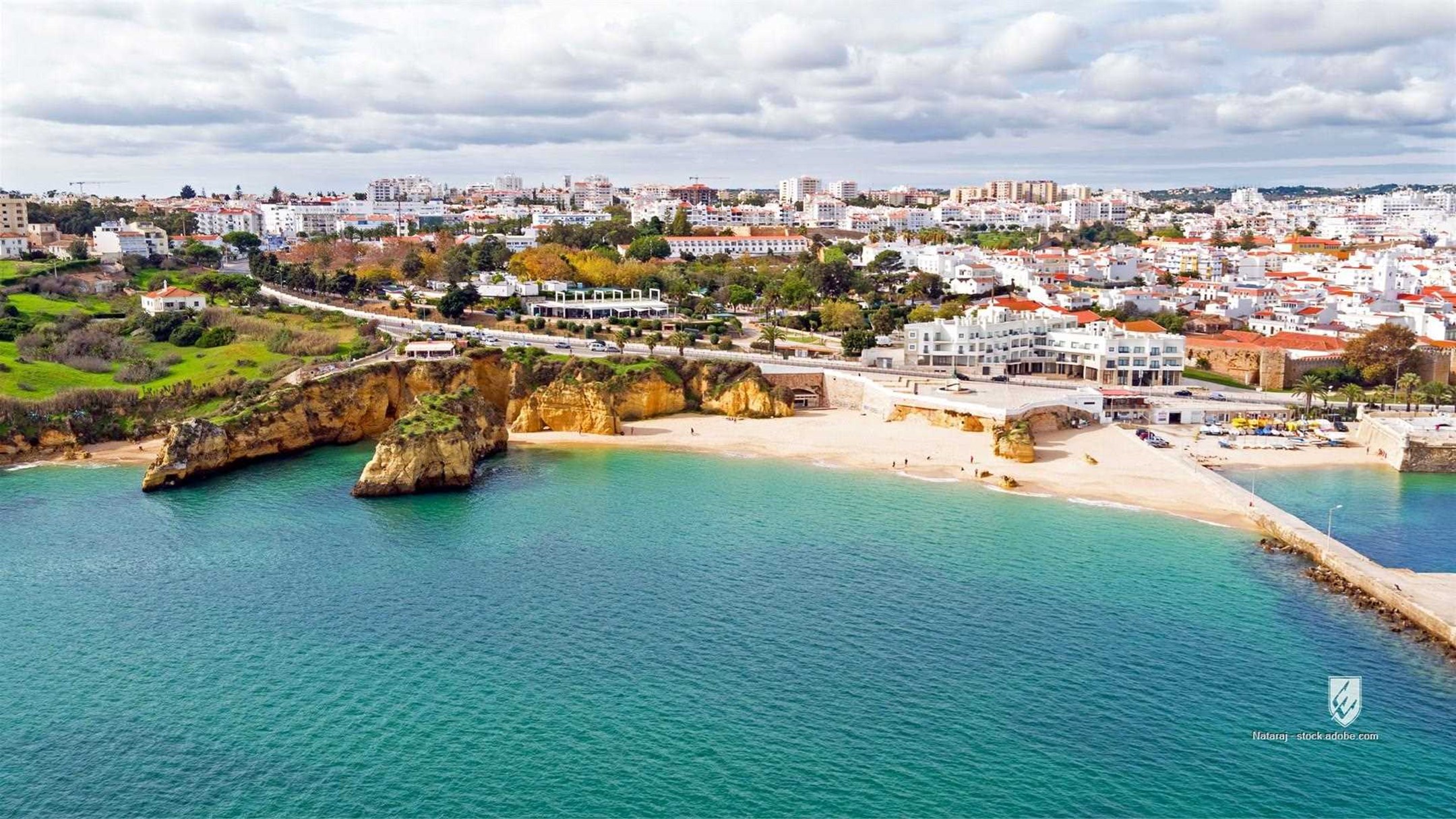 aerial algarve architectural architecture atlantic building city lagos nature ocean outdoor portugal sand scenic sea