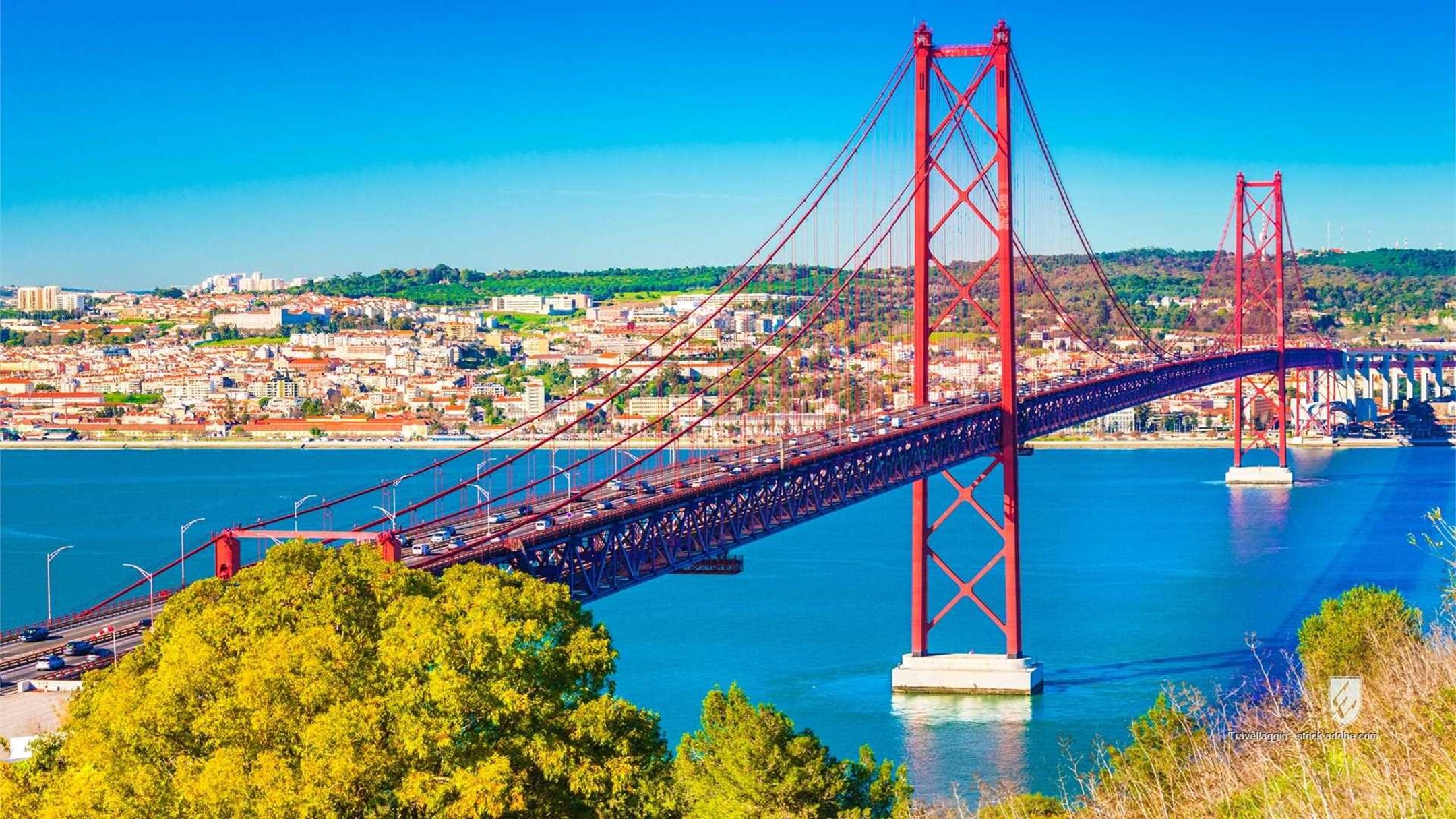 cityscape famous landmark popular europe blue across tagus almada river sky red suspension portuguese view city lisboa