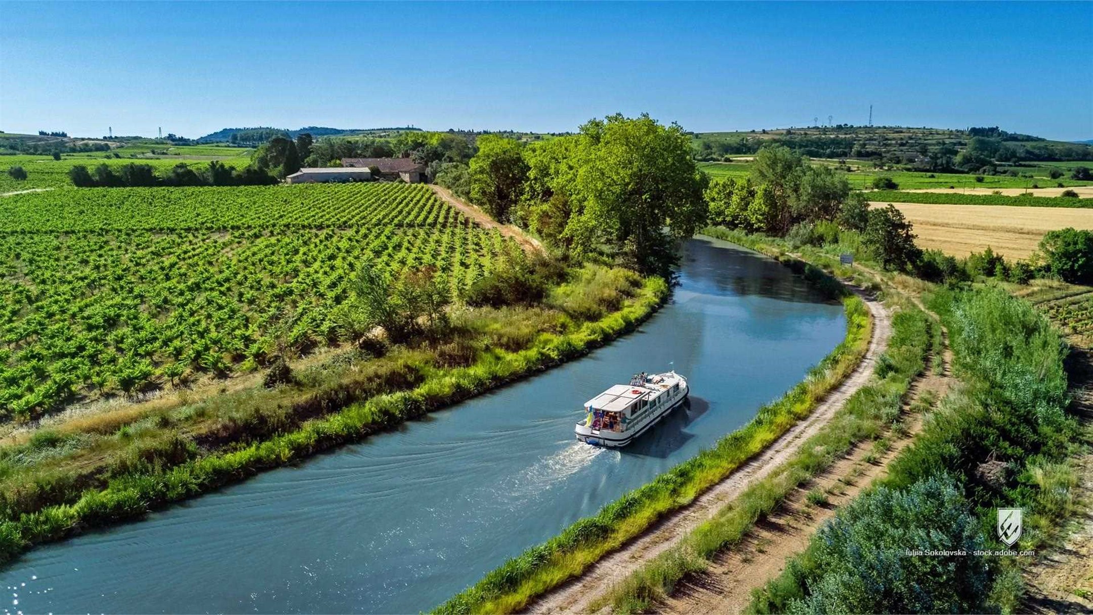 houseboat boat cruise vacation canal du midi france water tourism travel europe landscape aerial view canal trees outdoo